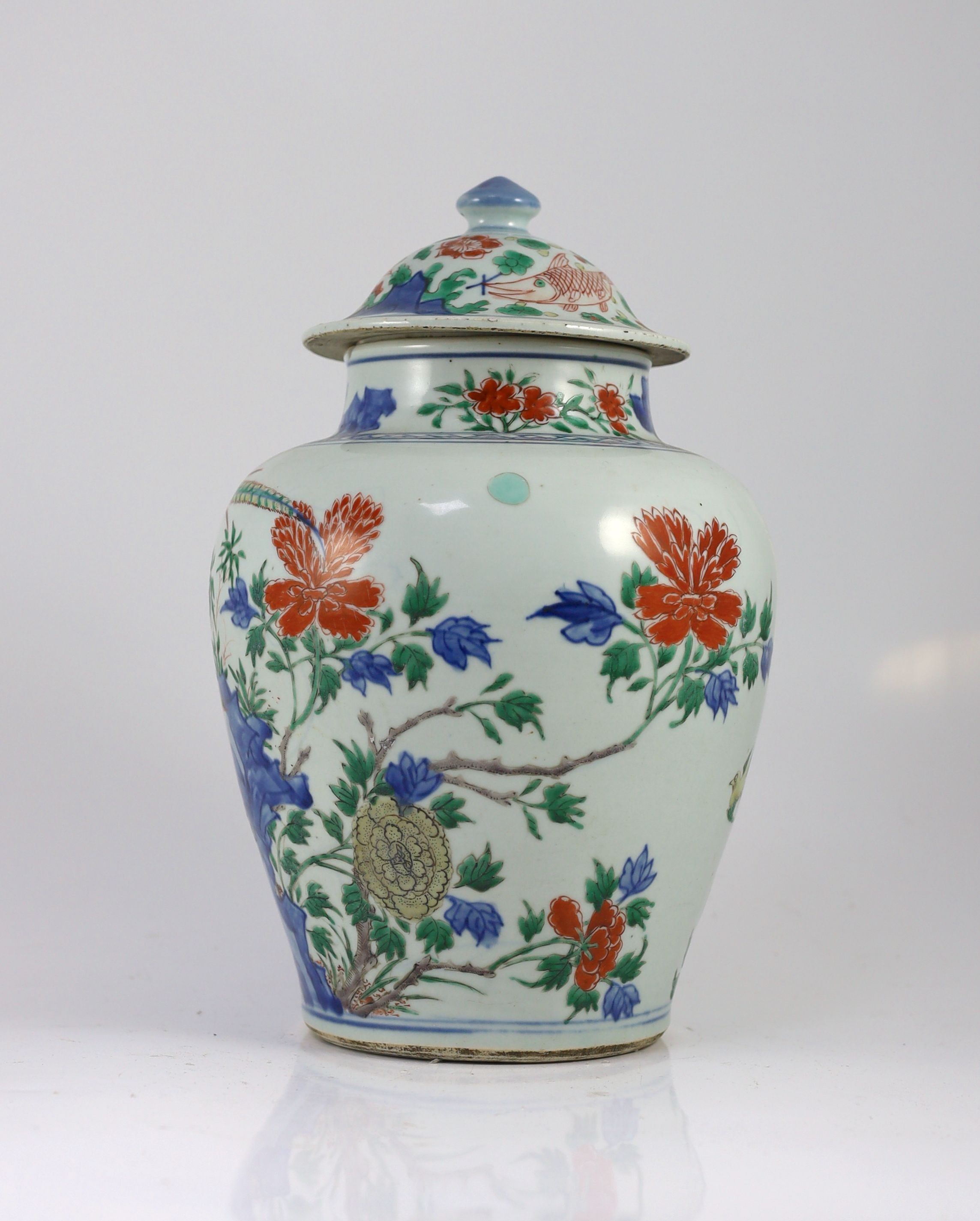 A Chinese transitional wucai jar and cover, c.1650, 36cm high, some damage